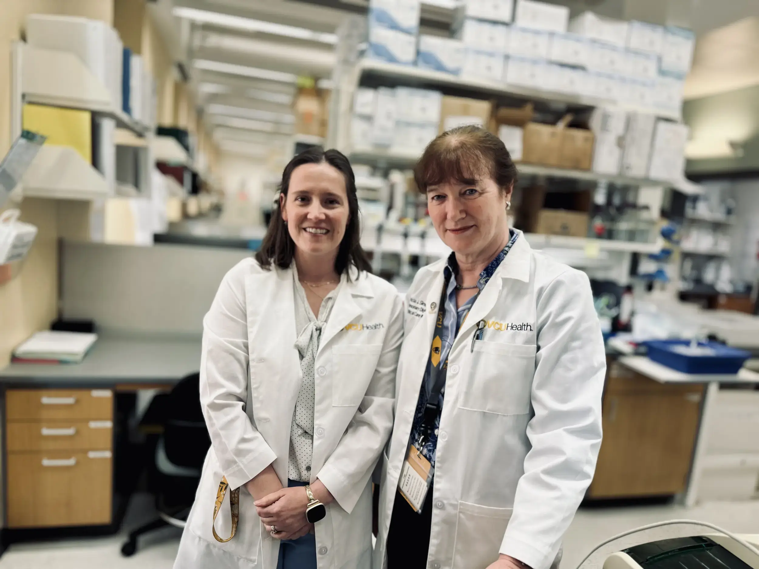 Postdoctoral fellow Maggie Freeberg, Ph.D. and Patricia Sime, M.D., chair of the Department of Internal Medicine at the School of Medicine, in their lab