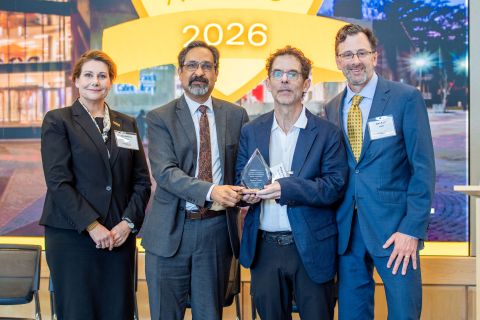 Stephen Vitiello receiving an award, standing with the vice president for research development, vice president for research, and the associate vice president for research at the 2026 ARIA event.